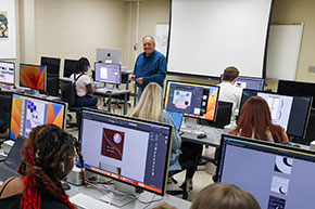 A professor teaching a classroom. Link to Gifts That Pay You Income