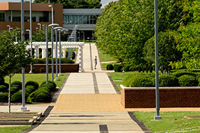 A student walking through campus. Link to What to Give